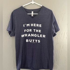 I’m here for the wrangler butts. Navy blue canvas, short sleeve T-shirt.